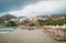 Straw umbrella on a sandy beach in Greece. Beach chairs with umbrellas on a beautiful beach in Crete island.