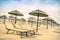 Straw umbrellas and sunbeds at Rimini beach in Italy