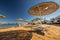 Straw umbrellas and sunbeds on the wonderful tropical beach.