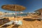 Straw umbrellas and sunbeds on the wonderful tropical beach.