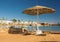 Straw umbrellas and sunbeds on the wonderful tropical beach.