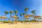 Straw umbrellas and sunbeds on the wonderful tropical beach.