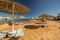 Straw umbrellas and sunbeds on the wonderful tropical beach.