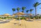 Straw umbrellas and sunbeds on the wonderful tropical beach.