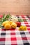 Strawberries, apricot, rowan flower, yellow dandelion lie on the table on the tablecloth