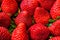 Strawberries background pile macro