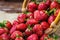 strawberries in basket, strawberry basket, strawberries on wooden table, strawberries on a brown background, basket with