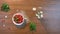 Strawberries and a bouquet of chamomiles on the table. Top view.