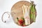 Strawberries and bundled asparagus on wooden tray