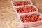 Strawberries in containers. Tasty berry. Red strawberry
