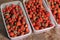 Strawberries in containers. Tasty berry. Red strawberry