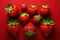 strawberries of different shapes on a red background created with Generative Al technology