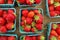 Strawberries displayed in baskets