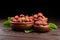 Strawberries with green leaves in wooden bowls on brown table. Red ripe berries, fresh juicy strawberries