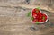 Strawberries heart rustic wooden background Food