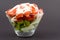 Strawberries with kiwi in transparent bowl with custard yoghurt