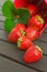 Strawberries leaf bucket wooden background