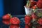 Strawberries in a plastic box closeup under the water drops in a dark blue background. Healthy lifestyle. Multivitamin cocktail.