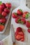 Strawberries sliced on a chopping board