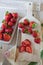 Strawberries sliced on a chopping board