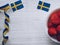 Strawberries and Swedish flags on white background