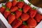 Strawberries in a white basket, bought in a Korean local farmer\\\'s market