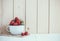 Strawberries in white enamel mug