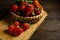 Strawberries in wooden bowl. Fresh nice strawberries on wooden table