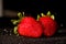 Strawberry on a black background. Brilliant background with berries