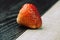 strawberry on a black and white wooden background close-up