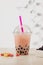 Strawberry Boba Bubble Tea with candy and crushed ice.