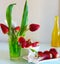 Strawberry bouquet in Green Glass With orchid on White Plate With Orchids