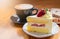 Strawberry cake, vanilla sponge cake with cream cheese and fresh strawberries with hot coffee