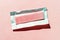 Strawberry chewing gum on a pink paper background