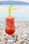 Strawberry cocktail. Evening relaxation with a glass of strawberry cocktail during the summer holidays on the Antisamos beach,