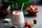 Strawberry coconut smoothie or milkshake in glass