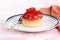 Strawberry custard glazed tart on a plate