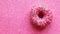 Strawberry donut on glitter pink  background