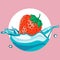 Strawberry falling in water splash