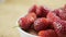 Strawberry fruit in white bowl, dolly shot