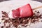 Strawberry ice cream popsicle lolly pops with whipped cream decorated chocolate on white wooden background. Top view