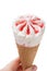 Strawberry ice cream in a waffle cone in hand, isolated