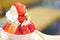 Strawberry kakigori Japanese shaved ice dessert flavor with vanilla ice-cream or bingsu Korea dessert serve on white bowl with