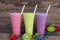 Strawberry kiwi and blueberry smoothies juice,beverage healthy the taste yummy In glass,drink episode morning on wooden background