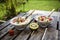 Strawberry-kiwi-yogurt with granola, chia-seeds and agave-syrup in glass bowls