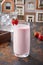 Strawberry Lassi served in glass isolated on table top view of punjabi culture