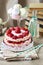Strawberry layer cake, french macaroons and bottle of lemonade