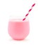 Strawberry milk in a glass tumbler with straw over white