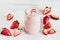 Strawberry milkshake in the glass jar white background