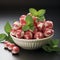 strawberry mints in a white ceramic bowl, red and white sweets with mint plants,